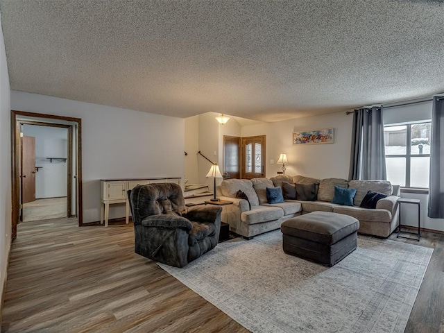 living room featuring hardwood / wood-style flooring and a textured ceiling