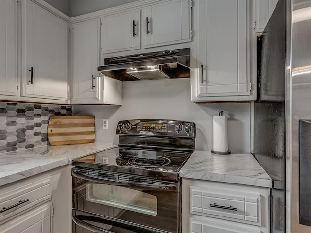 kitchen with range hood, light stone countertops, black range with electric cooktop, stainless steel refrigerator, and white cabinets