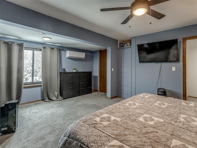 bedroom featuring carpet floors, ceiling fan, and a wall mounted AC