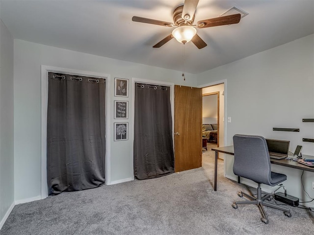 home office with ceiling fan and carpet flooring