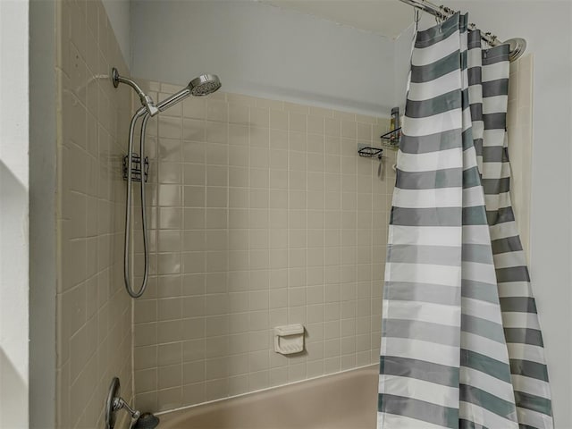 bathroom featuring shower / tub combo with curtain