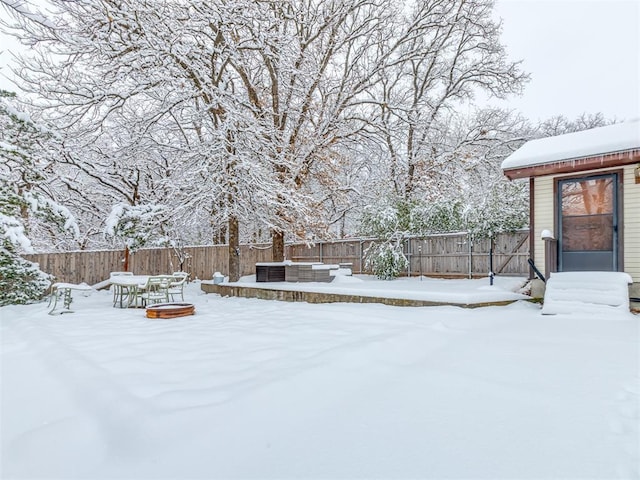 view of yard layered in snow