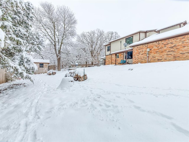 view of yard layered in snow