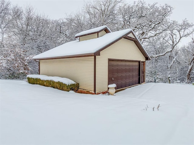 view of snow covered garage