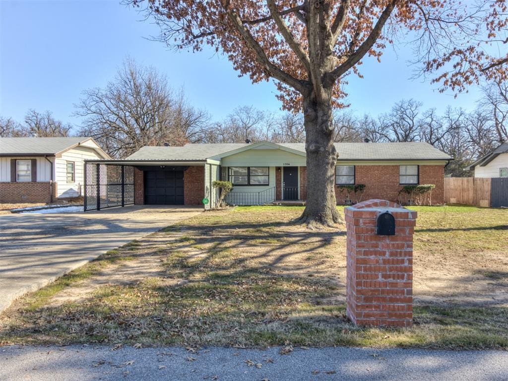 ranch-style home with a carport