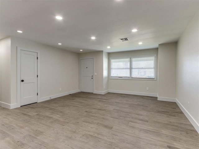 spare room featuring light hardwood / wood-style floors