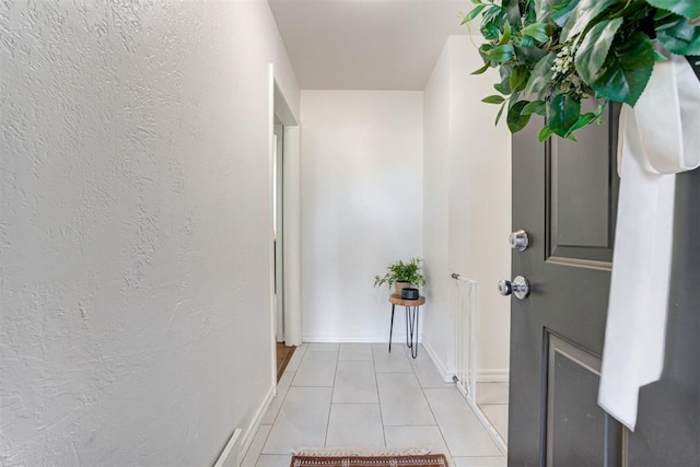 hall with light tile patterned flooring