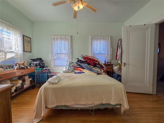 bedroom with light wood-type flooring and ceiling fan