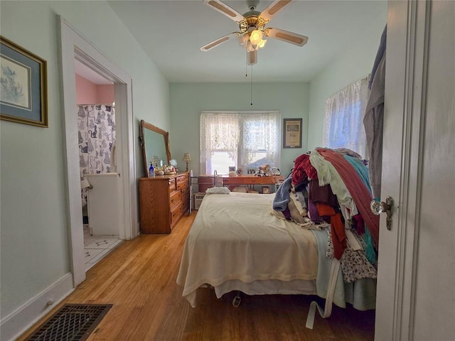 bedroom with ceiling fan and light hardwood / wood-style flooring