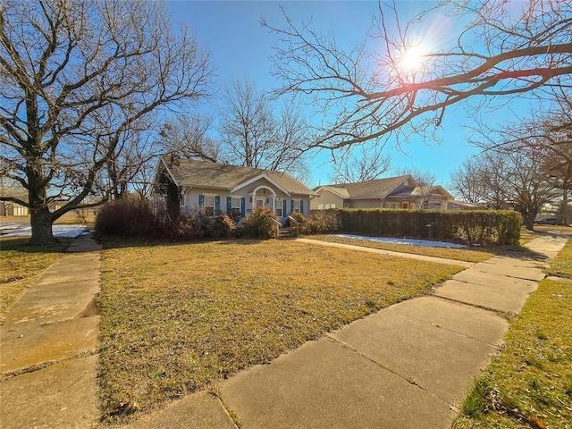 single story home with a front yard