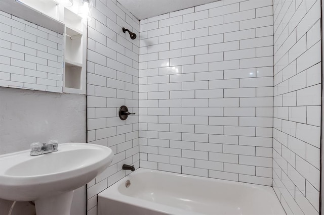 bathroom with sink and tiled shower / bath combo