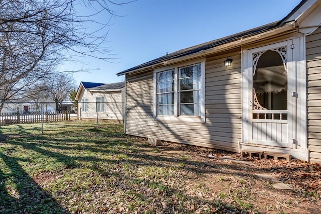 view of side of property featuring a yard