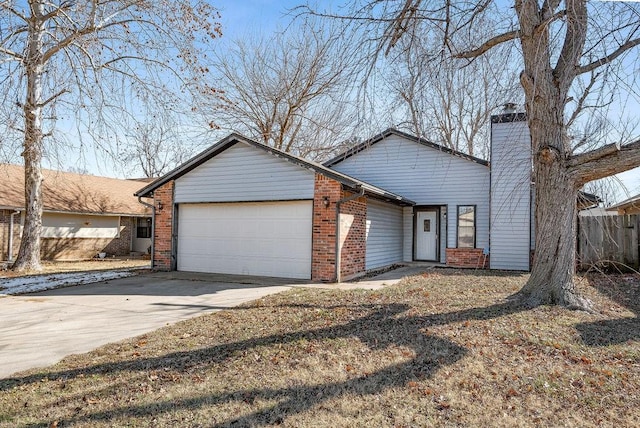 ranch-style home featuring a garage