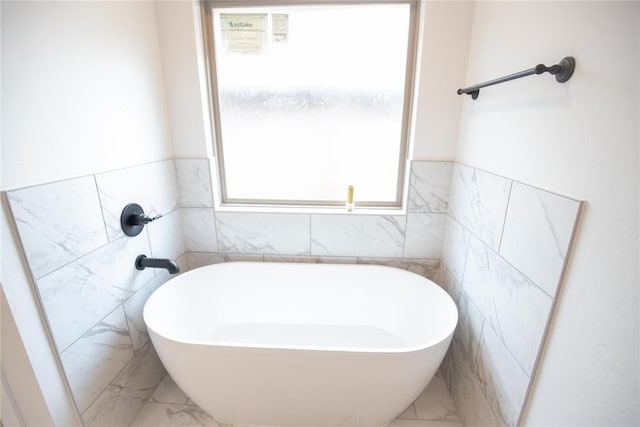 8108 NW 154th St, Edmond, OK 73013 - full bath featuring a freestanding tub, marble finish flooring, and tile walls