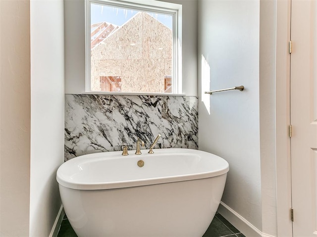 bathroom featuring a bathing tub and tile patterned flooring