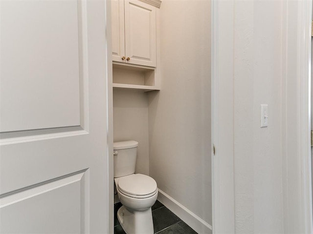 bathroom featuring tile patterned floors and toilet