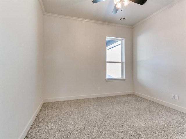 carpeted empty room featuring ornamental molding and ceiling fan