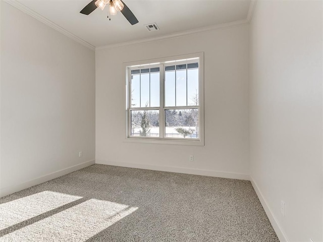 empty room with carpet floors, crown molding, and ceiling fan