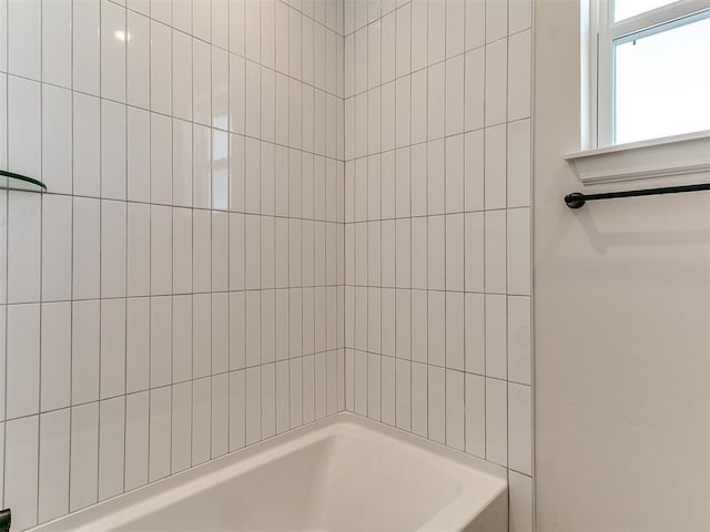 bathroom with shower / washtub combination