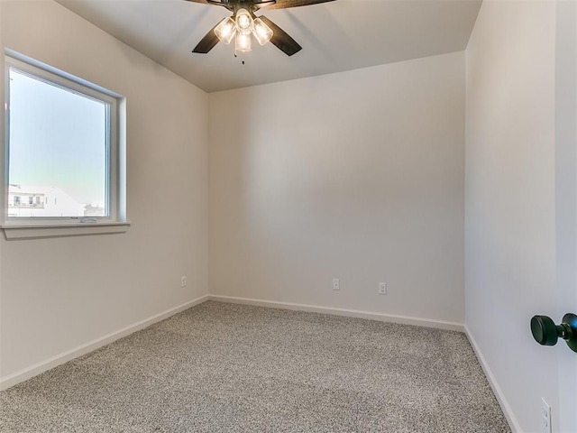 unfurnished room with carpet flooring and ceiling fan