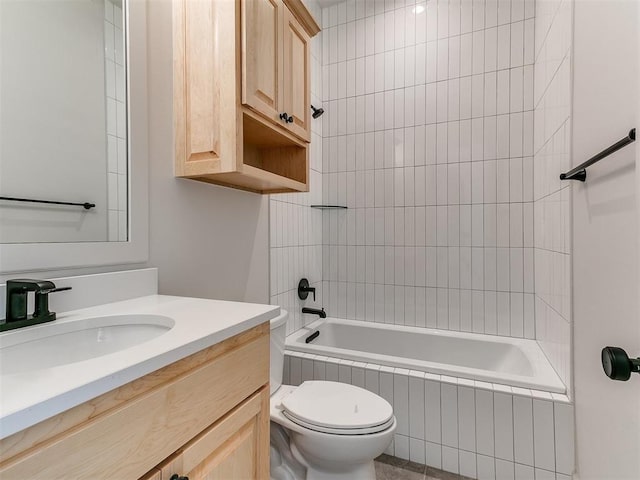 full bathroom with vanity, toilet, and tiled shower / bath