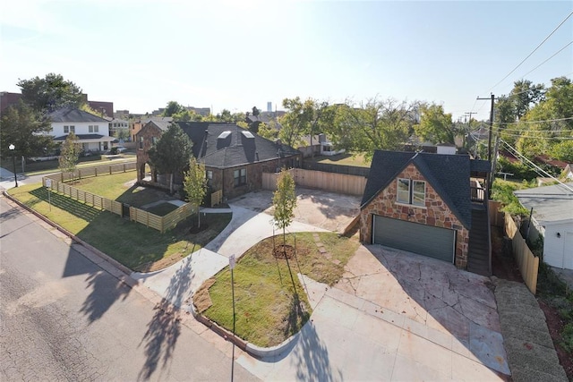 view of front of home with a front lawn and a garage