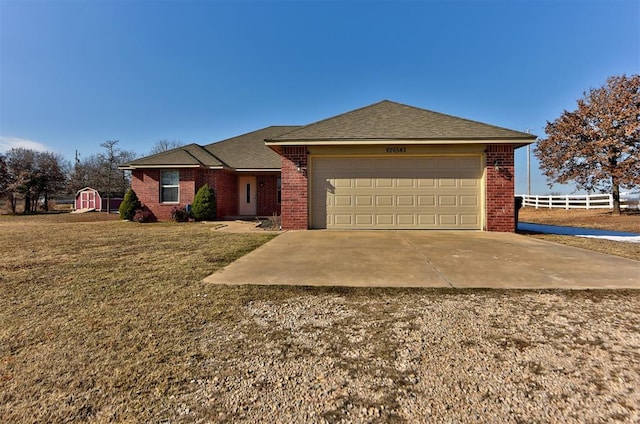 ranch-style house featuring a garage and a front yard