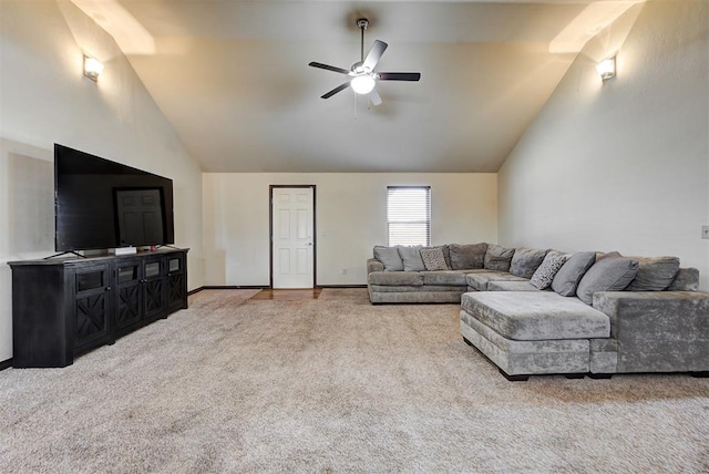 carpeted living room with ceiling fan and lofted ceiling