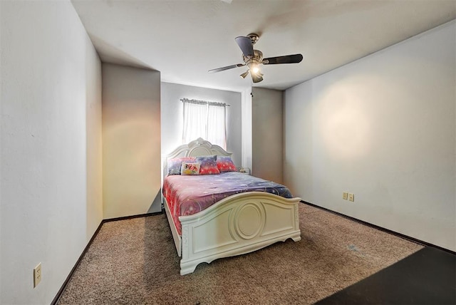 bedroom featuring dark colored carpet and ceiling fan