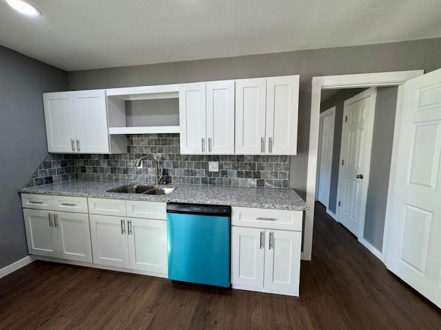 kitchen featuring white cabinetry, sink, light stone countertops, dark wood-type flooring, and dishwashing machine