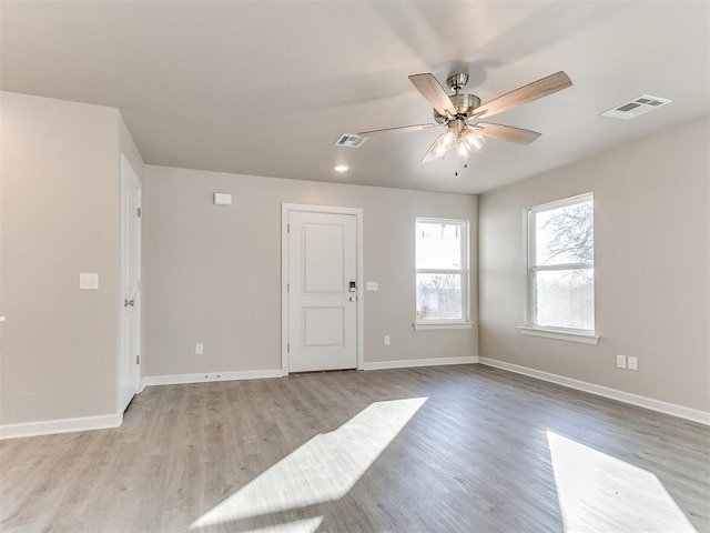 unfurnished room featuring ceiling fan and light hardwood / wood-style floors