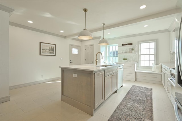 kitchen with stainless steel dishwasher, sink, a center island with sink, white cabinets, and hanging light fixtures