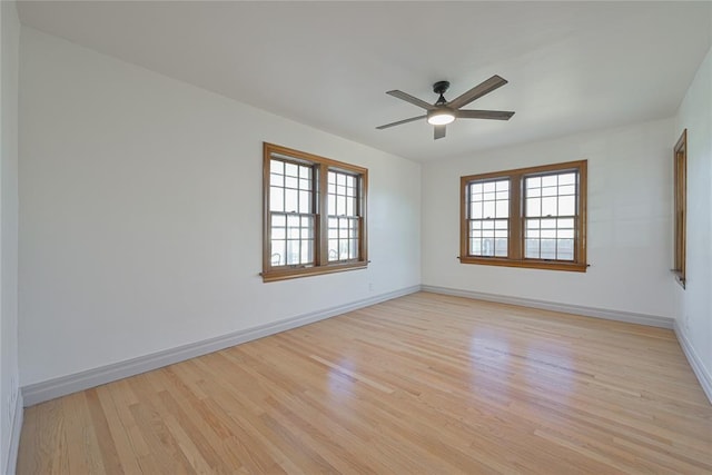 empty room with ceiling fan and light wood-type flooring