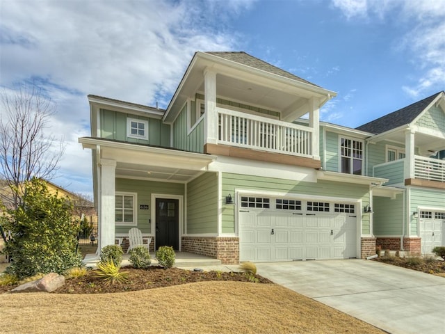 view of front of house with a garage and a balcony