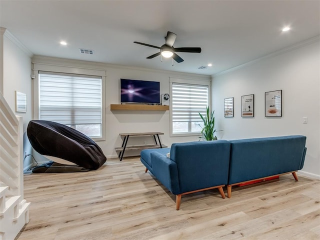 living room with ceiling fan, light hardwood / wood-style floors, and ornamental molding