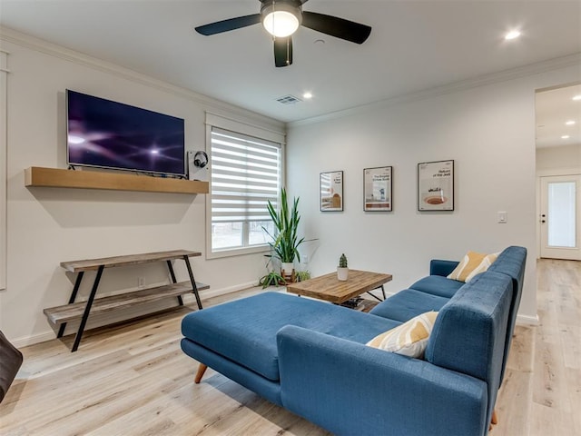 living room with ceiling fan, light hardwood / wood-style flooring, and crown molding