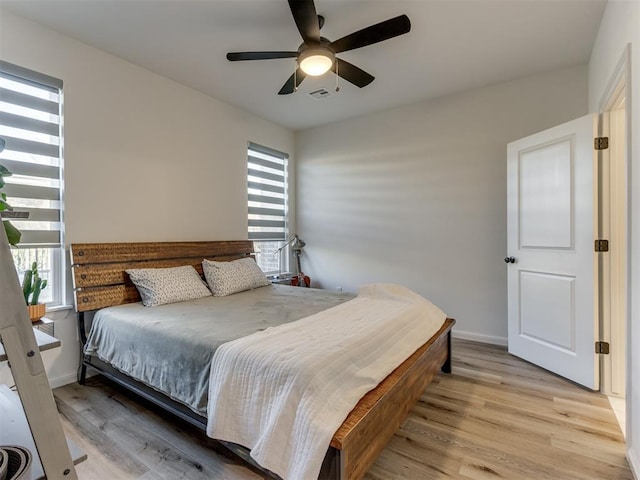 bedroom featuring light wood-type flooring and ceiling fan