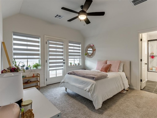 bedroom with carpet floors, connected bathroom, access to outside, vaulted ceiling, and ceiling fan