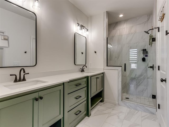 bathroom with a shower with shower door and vanity