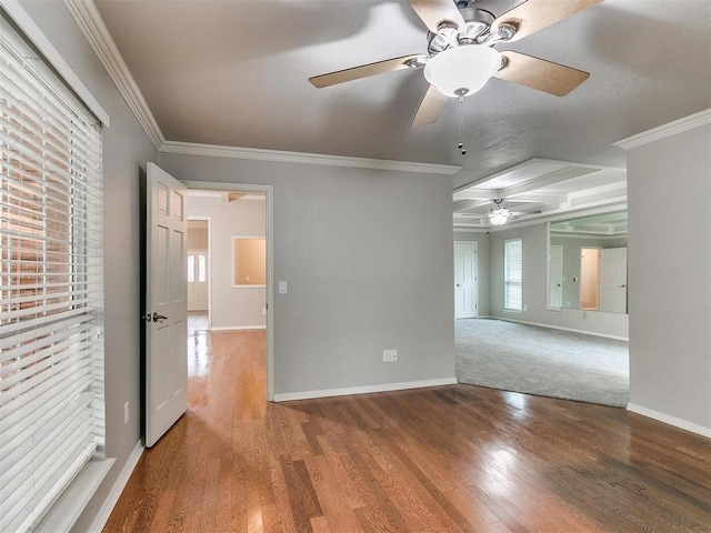 unfurnished room with hardwood / wood-style flooring, ceiling fan, and ornamental molding