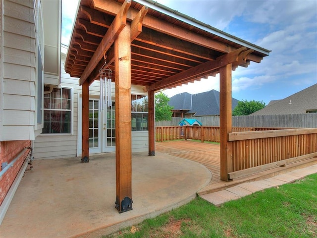 view of patio with a wooden deck and french doors