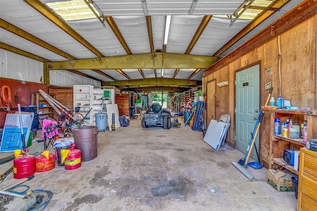 garage featuring wooden walls