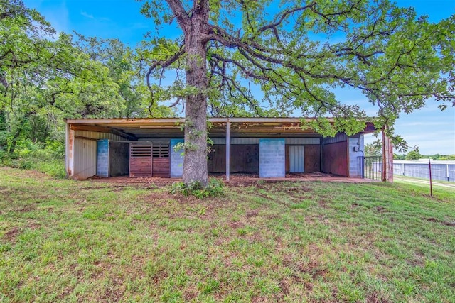 view of outbuilding with a yard