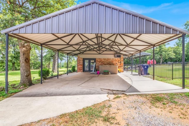 view of vehicle parking with a carport and a lawn