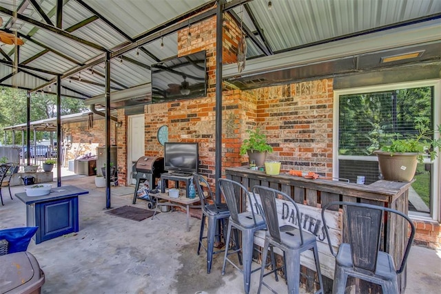 view of patio / terrace with area for grilling and exterior bar