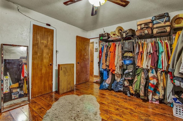 interior space with ceiling fan and hardwood / wood-style flooring