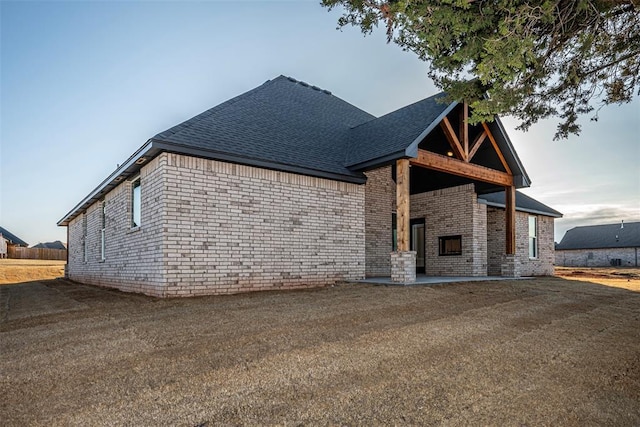 1127 Deer Rdg, Tuttle, OK 73089 - view of home's exterior featuring roof with shingles and brick siding