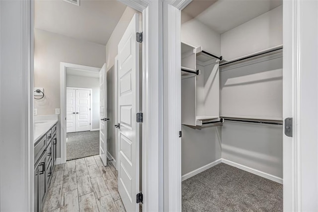 1127 Deer Rdg, Tuttle, OK 73089 - spacious closet with light colored carpet