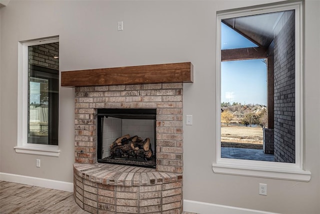 1127 Deer Rdg, Tuttle, OK 73089 - detailed view of a brick fireplace and wood finished floors