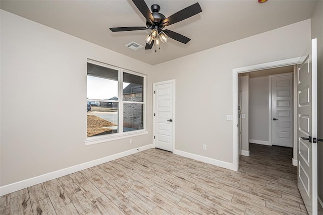 1127 Deer Rdg, Tuttle, OK 73089 - empty room with a ceiling fan and wood finished floors